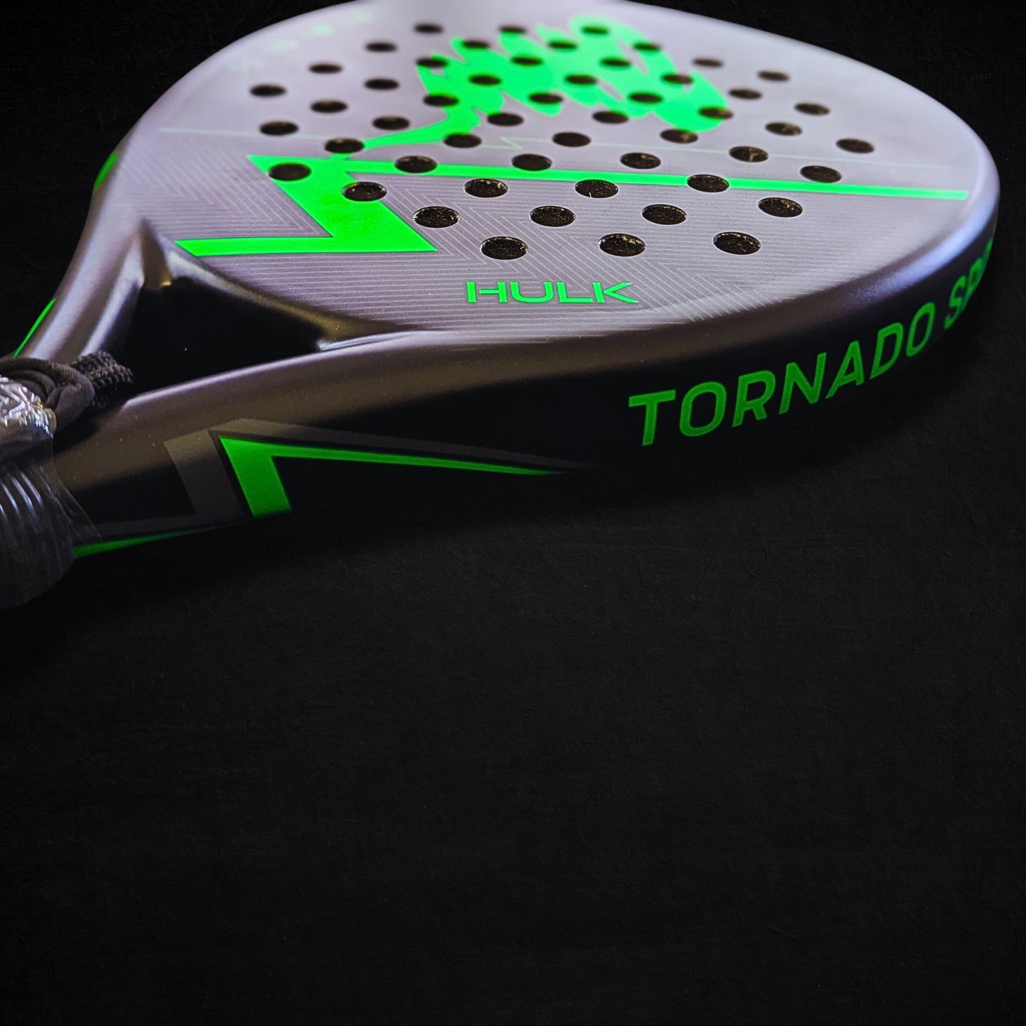 neon green padel racket close up