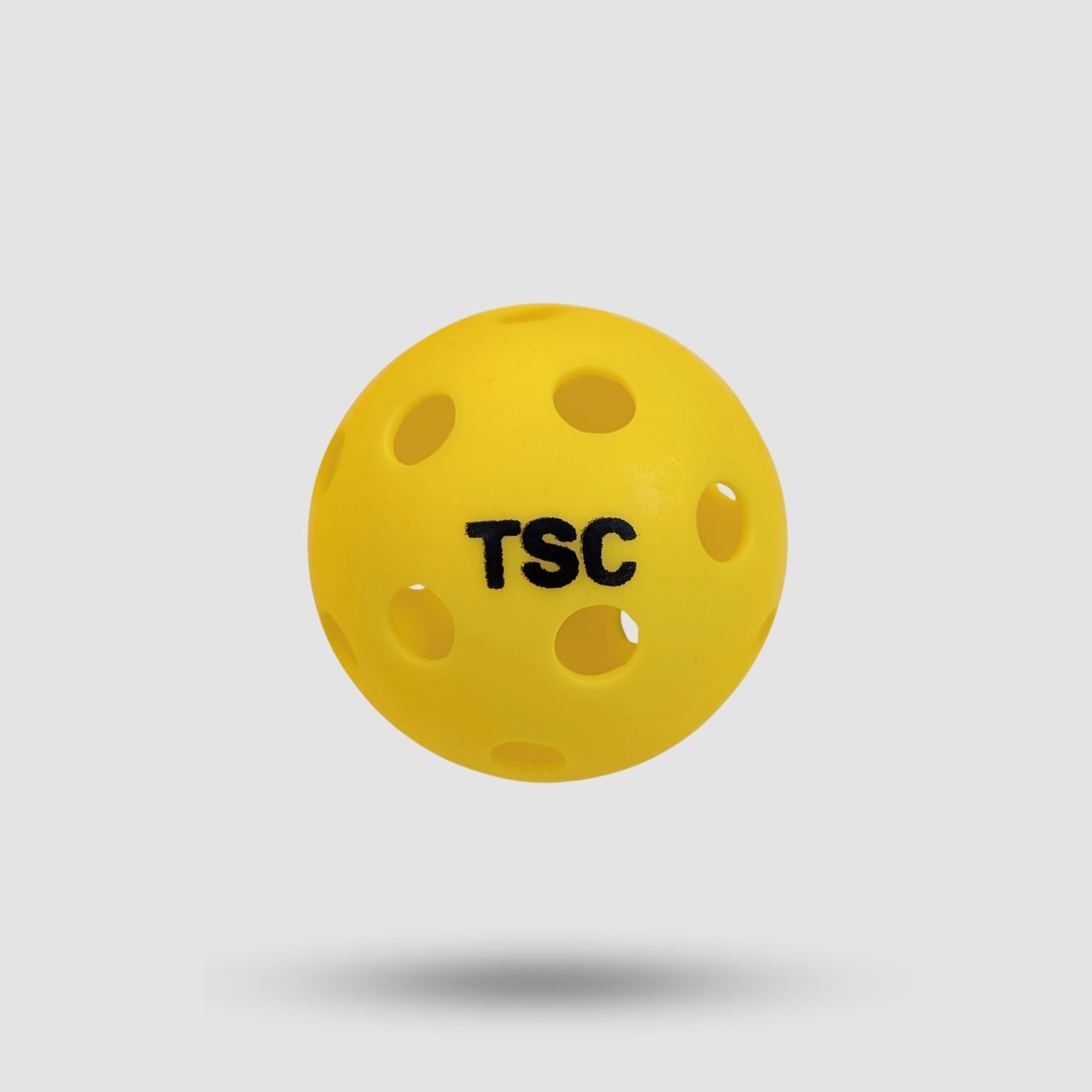 Tornado Sports neon green outdoor pickleball (40 small holes) vs. orange indoor pickleball (26 large holes) for gyms, parks, or tournaments.