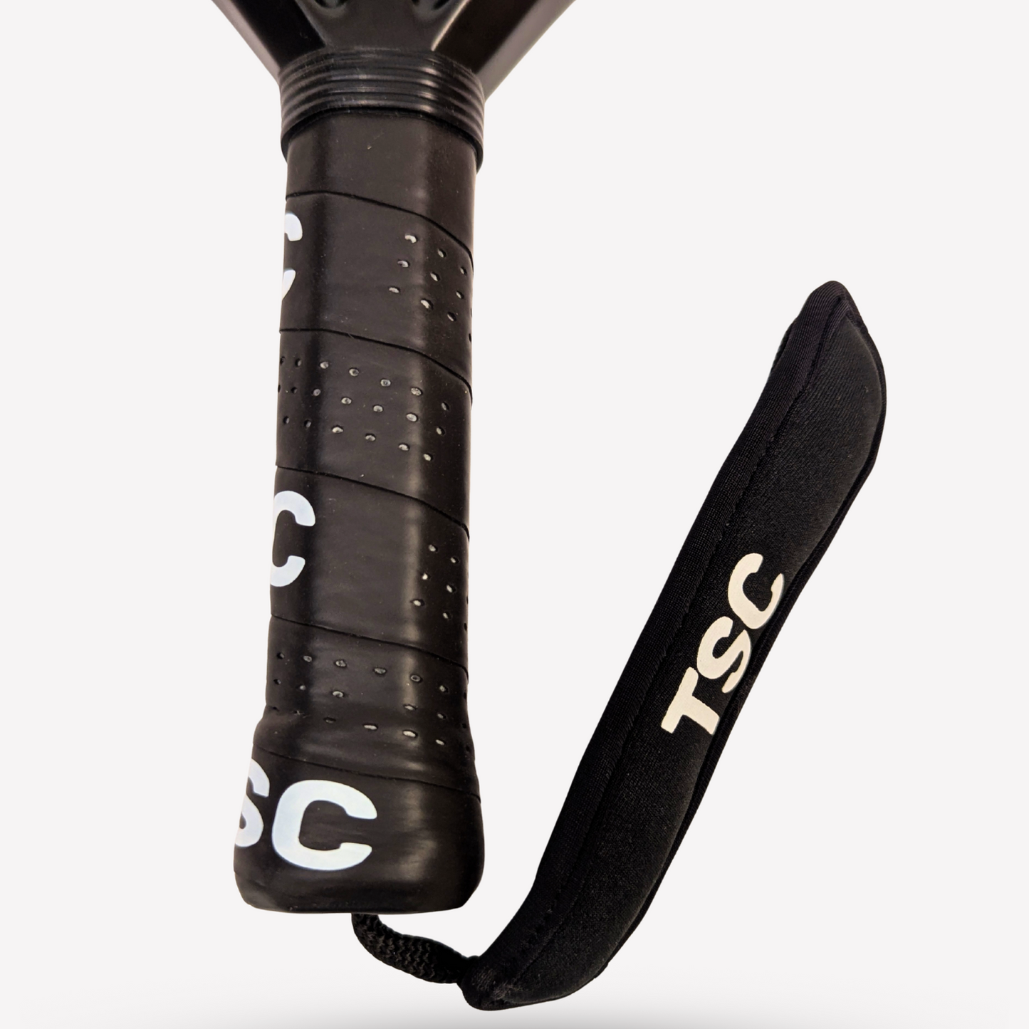 Black paddle with TSC branding on a white background aluminized 12K carbon fiber