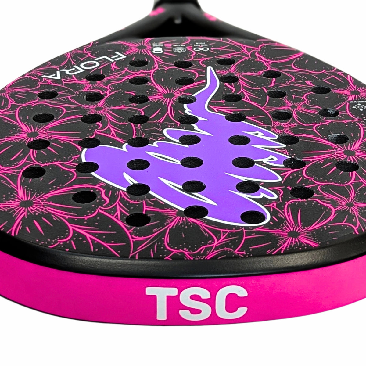 Close-up of a padel racket head with a black and pink floral pattern, a purple central logo, and a bright pink frame band with white 'TSC' lettering. for women and kids 