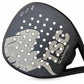 Close-up of a black and gray TSC Gladiator paddle padel frame head with a textured face, circular port holes, and a silver graphic logo on a white background. Padel racket in spain Nox adidas 