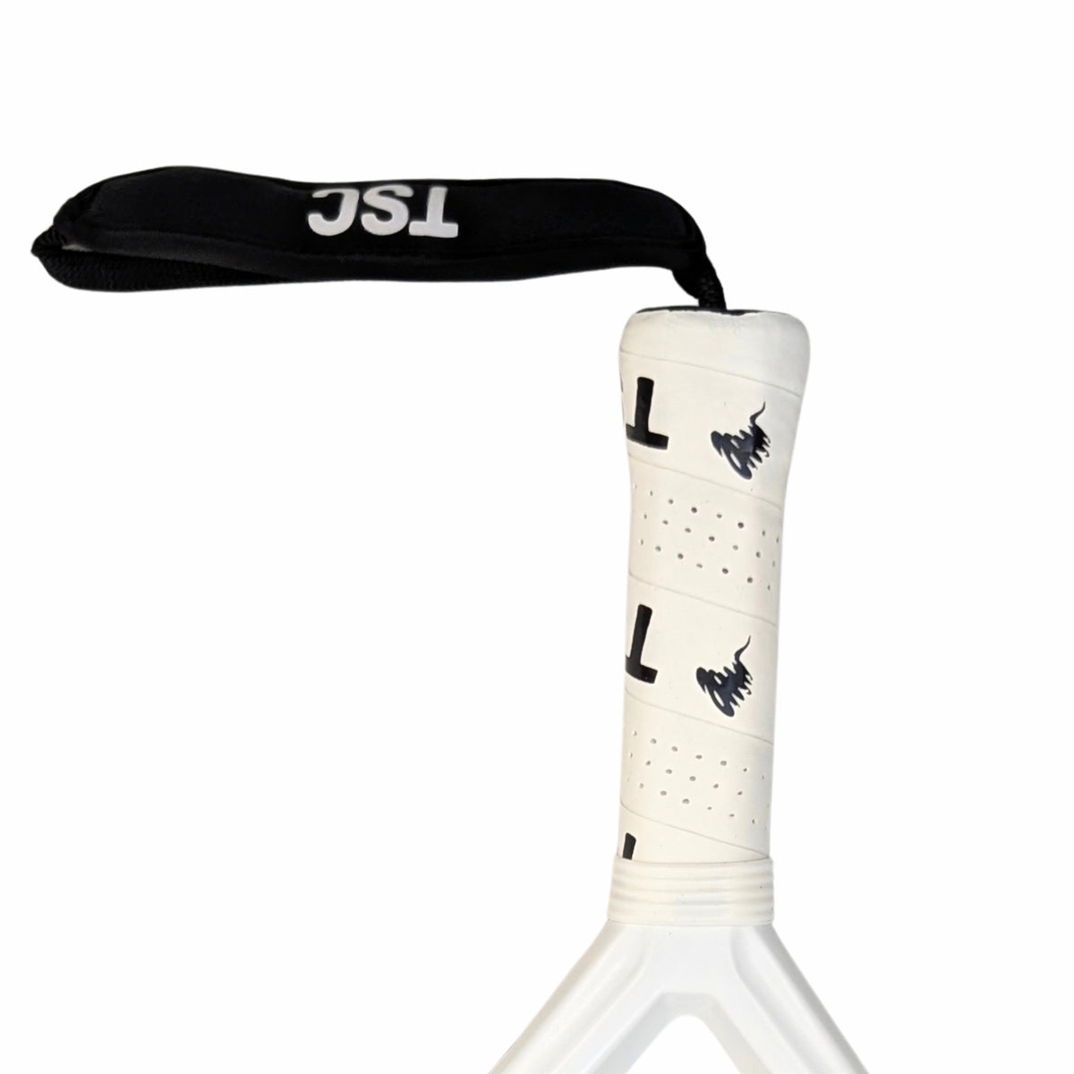 A close-up of a white padel tennis racket handle wrapped with white grip tape featuring black logos, connected to a black wrist strap with white 'TSC' branding, on a solid white background. best padel tennis racket grip 