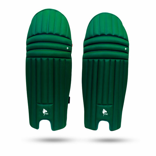 Pair of green cricket pads on a white background