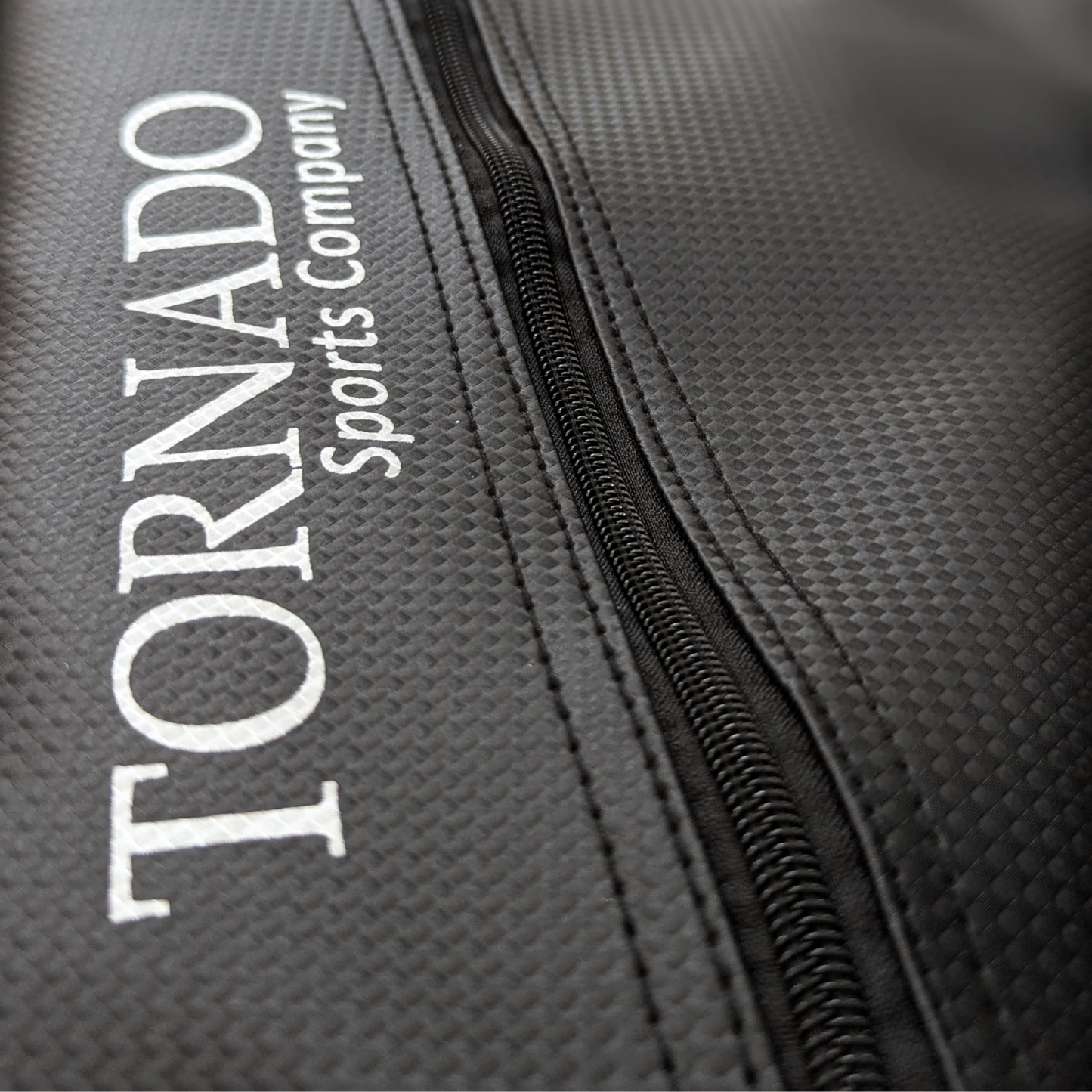 Close-up of a black padel tennis racket cover with 'Tornado Sports Company' branding.